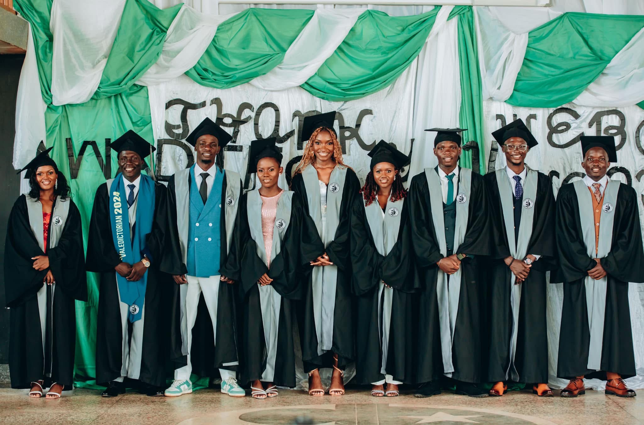 The first graduating class from FNC Academy wearing caps and gowns. 