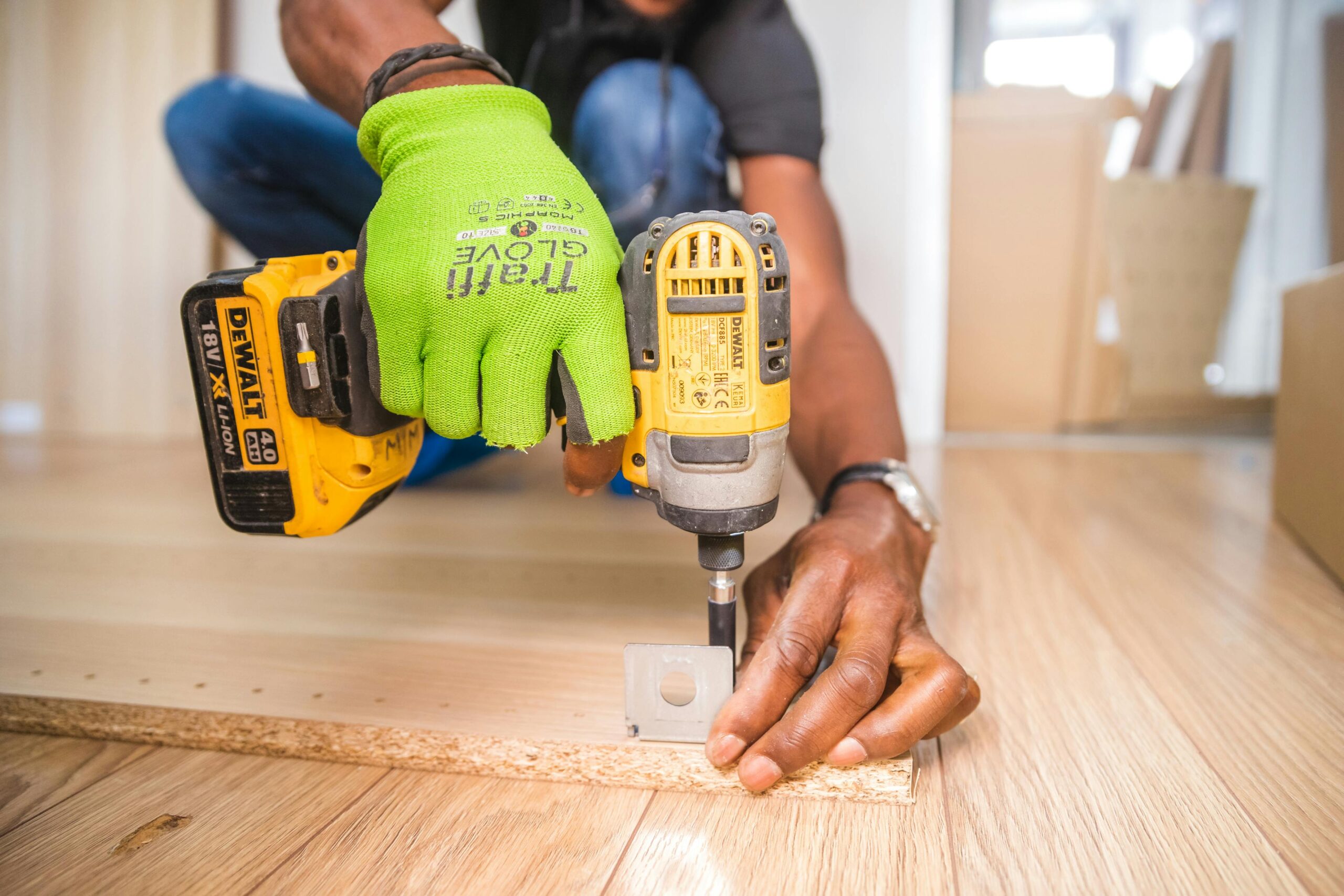 pexels-bidvine-517980-1249611 A construction worker with a drill.