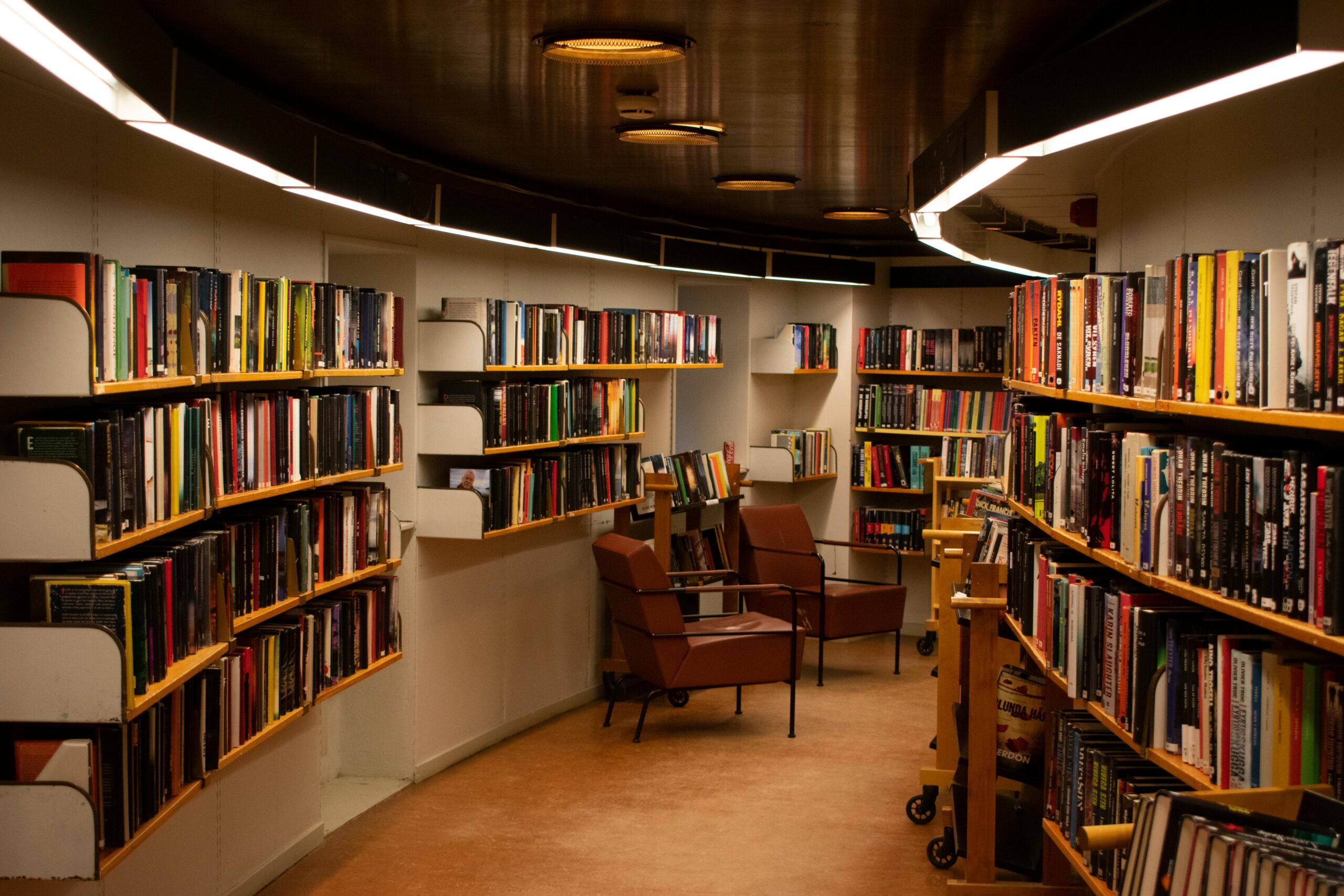 A library with bookshelves lining the walls. 